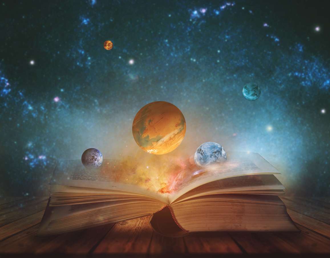 Book of the universe – opened magic book with planets and galaxies. Elements of this image furnished by NASA